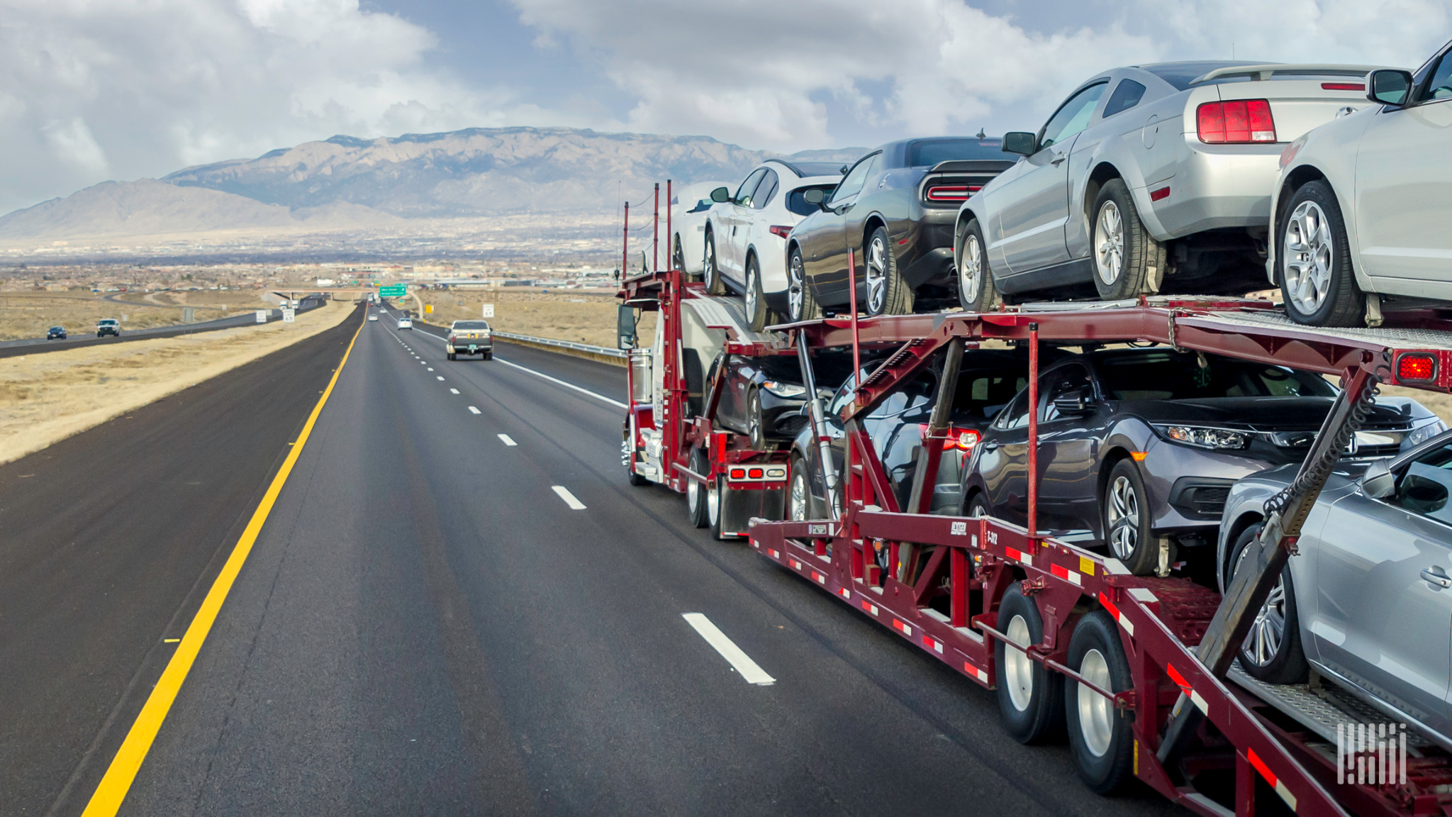 Car hauler transporting vehicles on a highway
